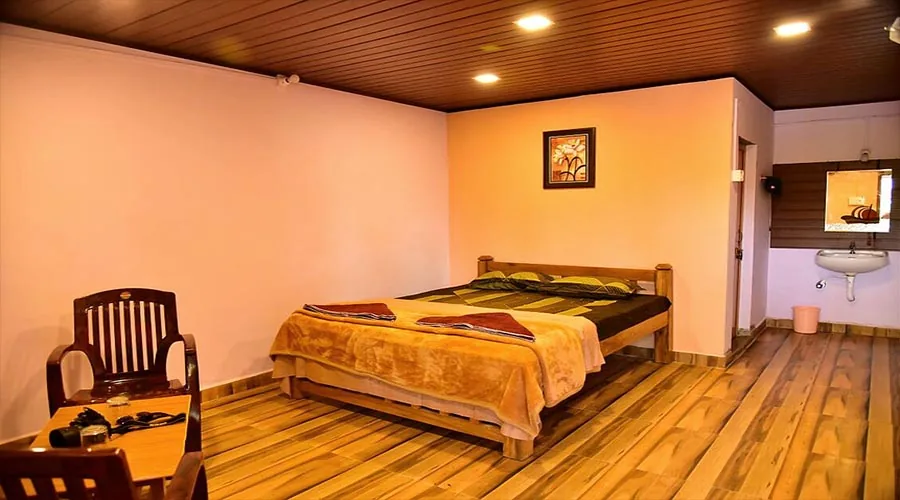 Cottage room with washbasin at Dandeli River Edge Resort