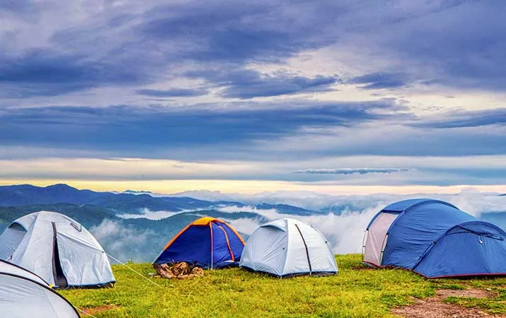 Hilltop camping tents with misty mountain view near Dark Forest Resort Homestay Dandeli