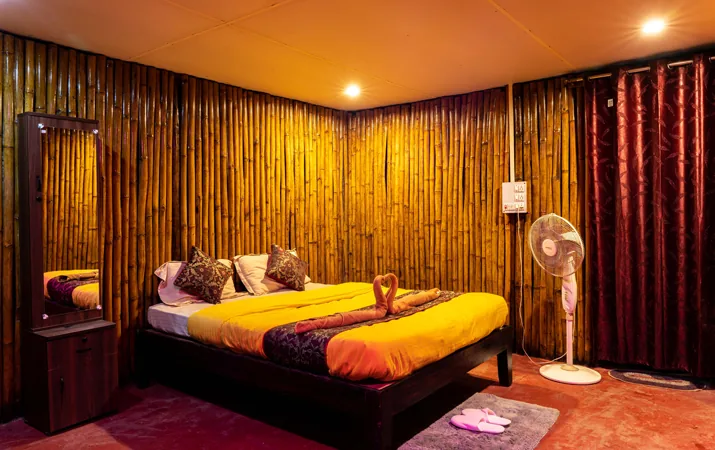 Bamboo cottage bedroom at Dark Forest Resort Homestay Dandeli
