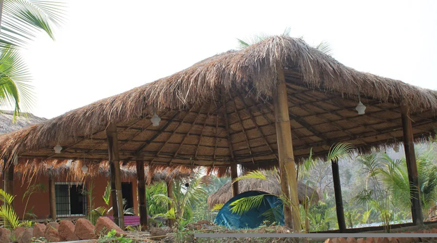 Bamboo pavilion, orange cottage and tent at Jungle Nest Dandeli