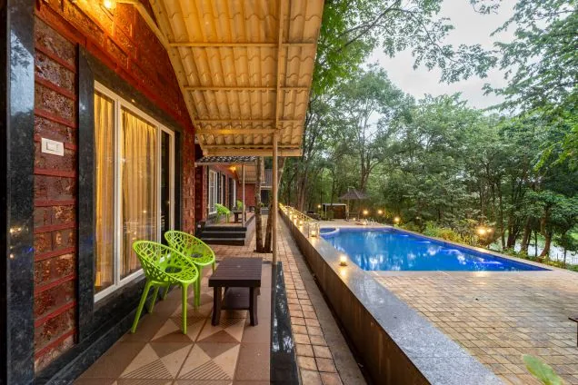 Pool-view sit-out at a Jungle View Cottage Dandeli cottage