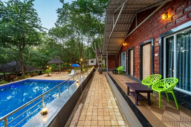 Cottage verandah beside the pool at Jungle View Cottage Dandeli