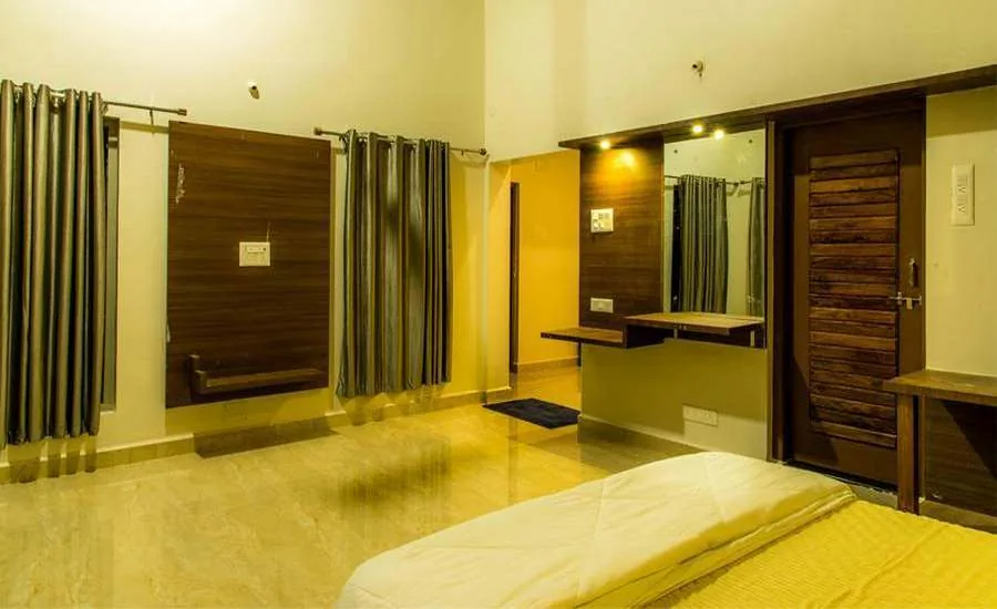 Cottage bedroom interior at Parampara Cottages Dandeli