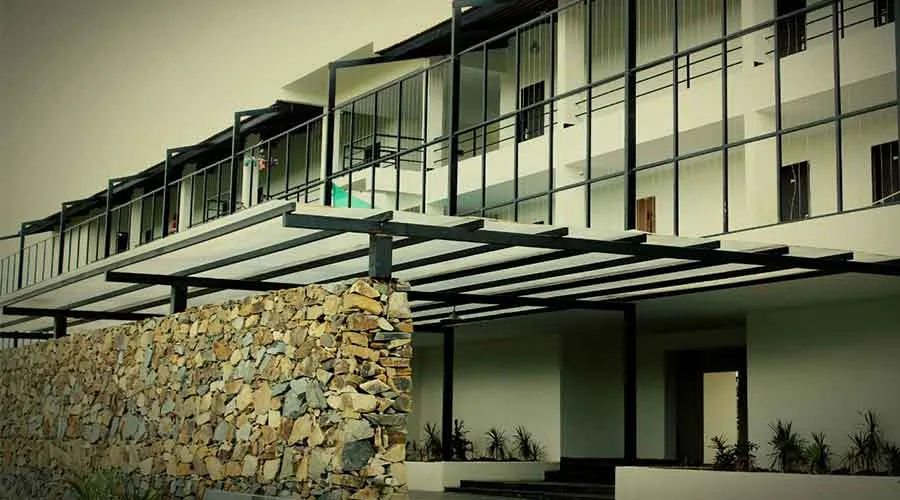Stone wall and balcony walkway at Starling River Resort Dandeli