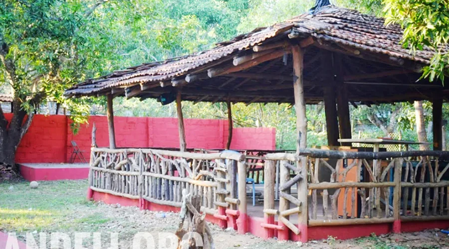 Rustic thatched pavilion at Tiger Camp Dandeli